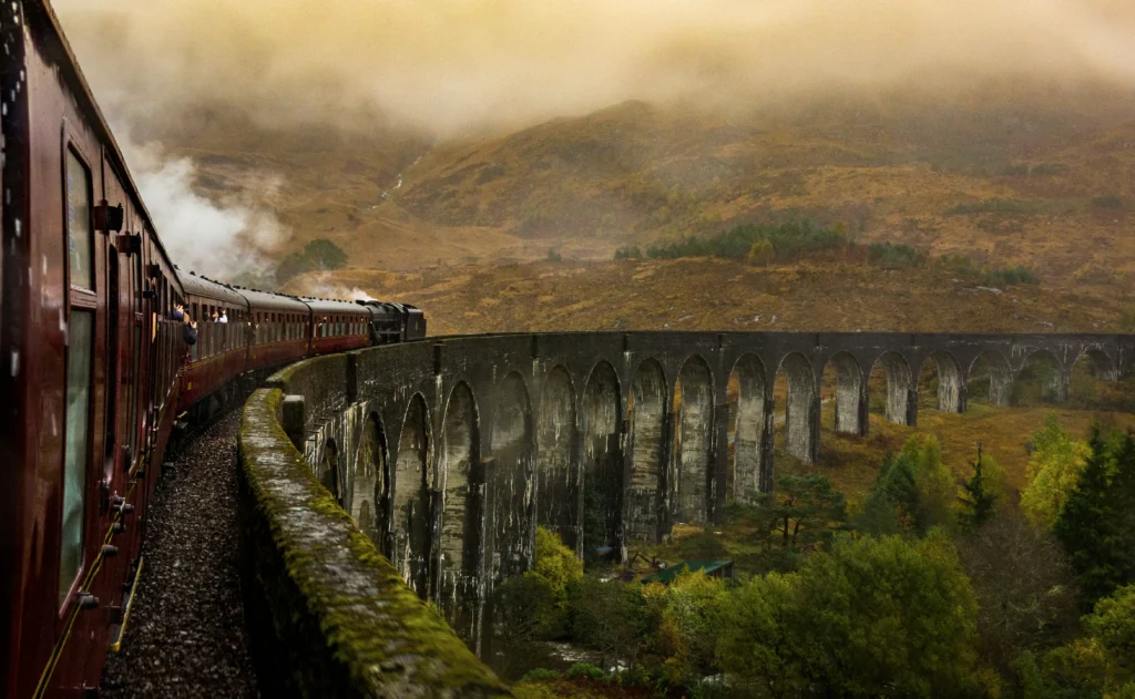 The Jacobite steam train crossing the Glenfinnan Viaduct in the Scottish Highlands