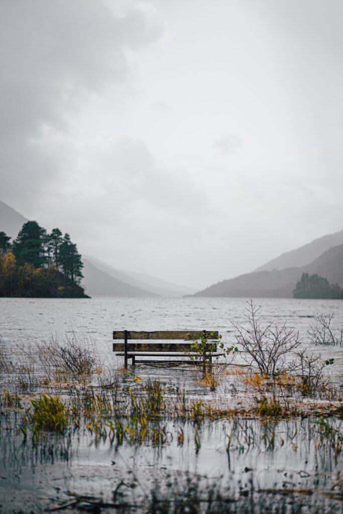 A bench on the shore of Loch Shiel at Glenfinnan, looking down the loch to the mountains