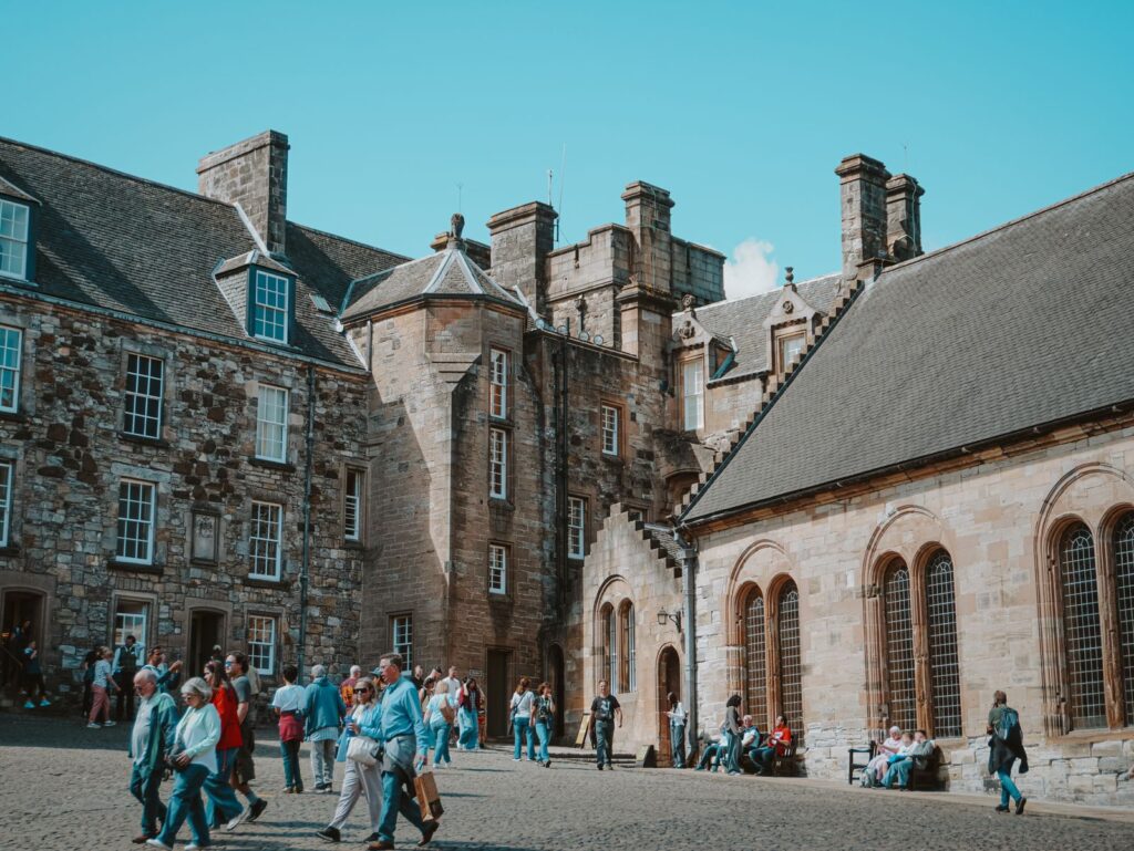 Visitors in the Inner Close at Stirling Castle, with the Chapel Royal on the right and the King's Old Building behind