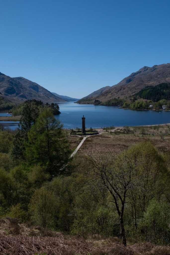The Glenfinnan Monument at the head of Loch Shiel, surrounded by mountains