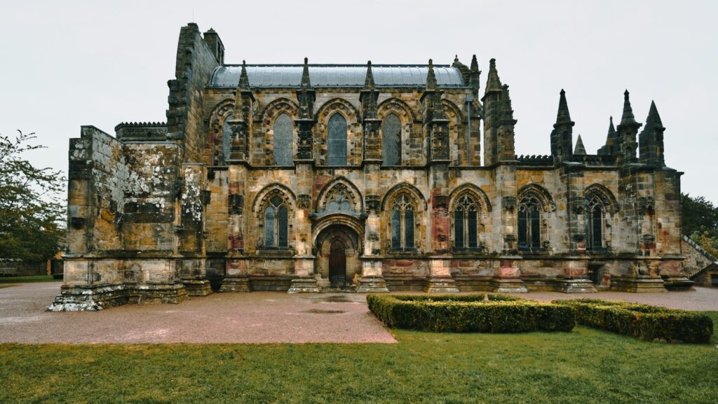 Rosslyn Chapel and its carved stone exterior in Roslin, near Edinburgh