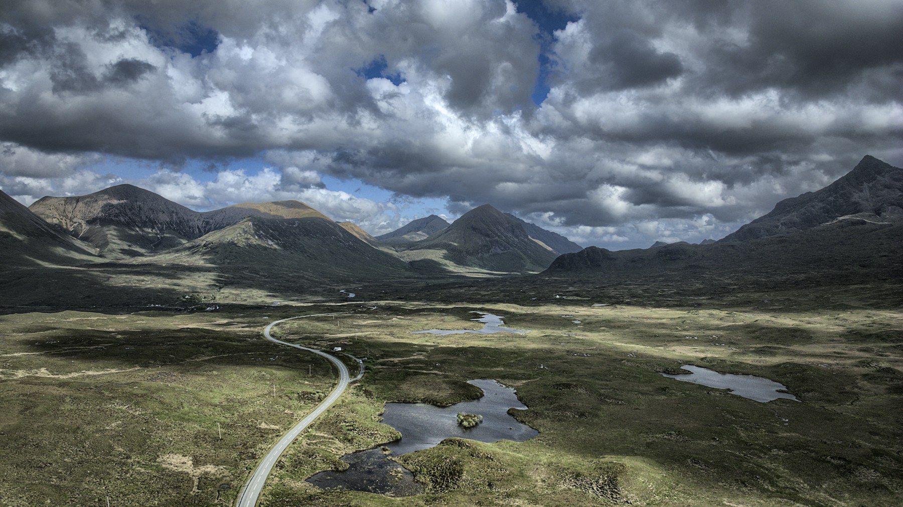 The Cuillin mountains and the road through Glen Sligachan under a dramatic sky on the Isle of Skye